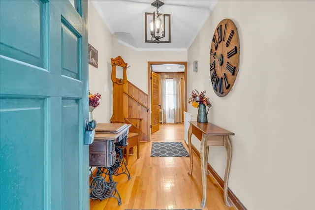 a view of entryway livingroom and hall with wooden floor
