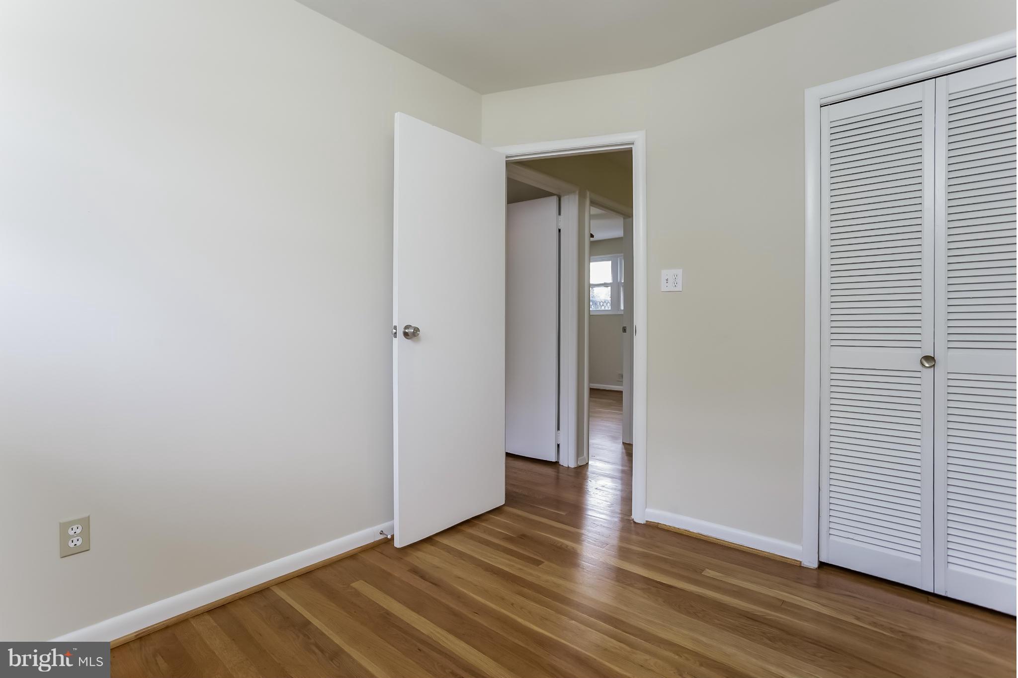 2818 Radius Road Silver Spring, MD 20902 - Photo 14 of 30 a view of an empty room with wooden floor