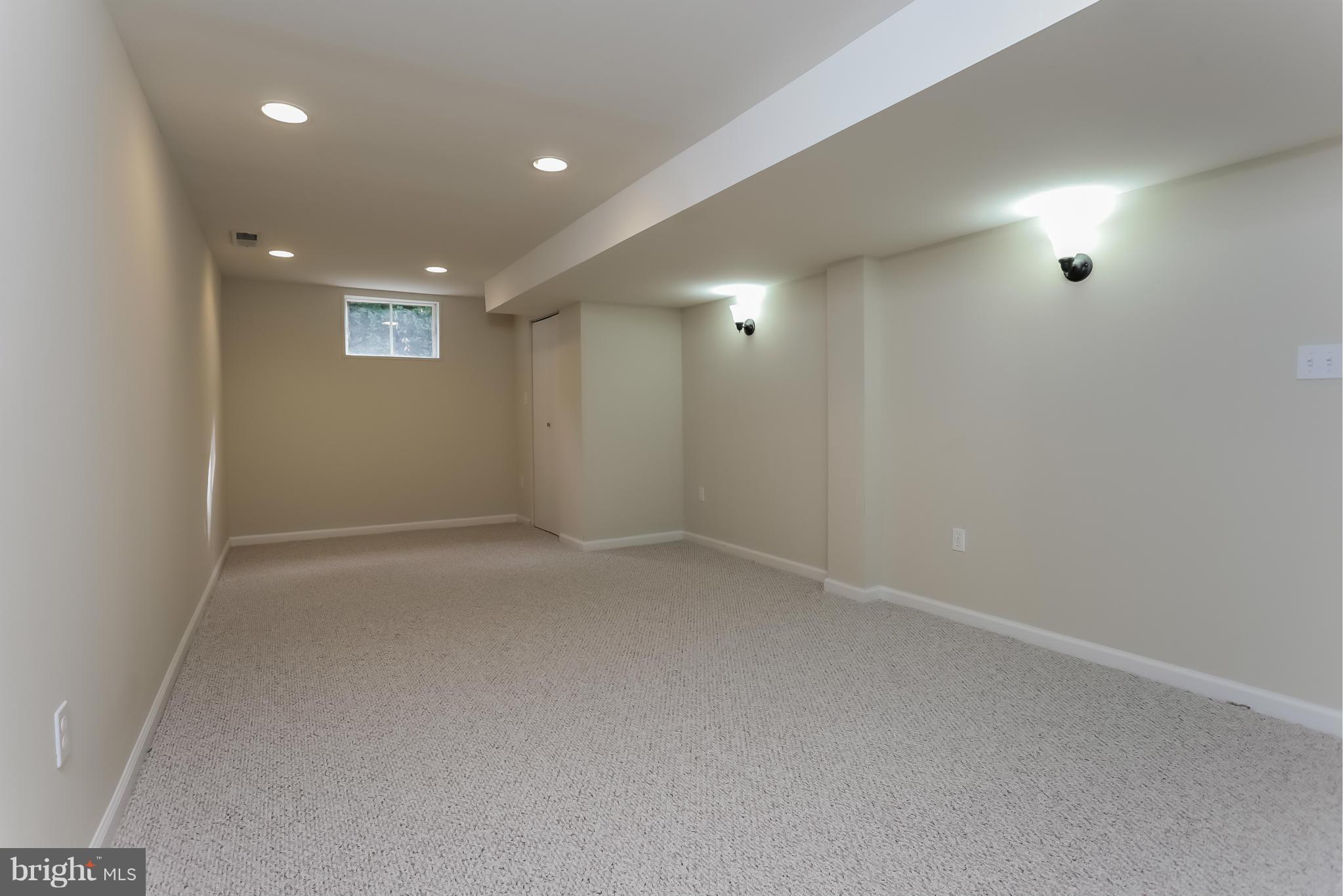 2818 Radius Road Silver Spring, MD 20902 - Photo 22 of 30 an empty room with windows and entrance
