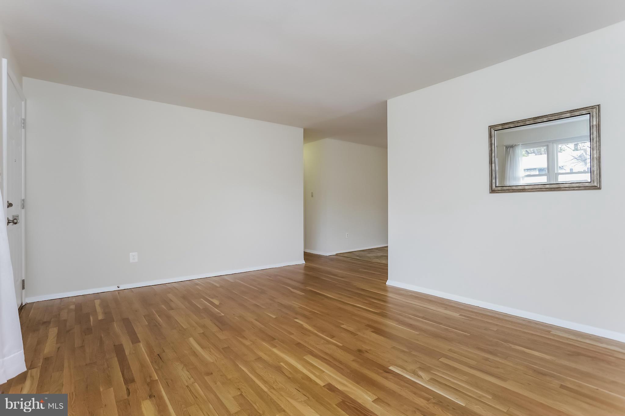 2818 Radius Road Silver Spring, MD 20902 - Photo 4 of 30 a view of an empty room with wooden floor
