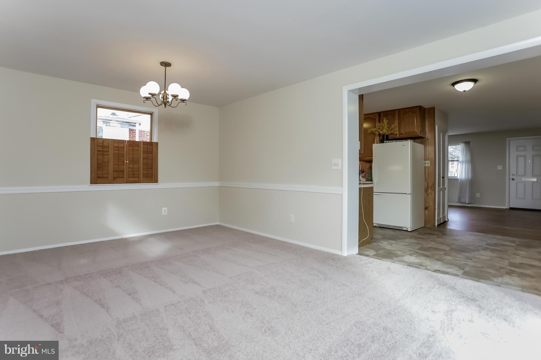 2818 Radius Road Silver Spring, MD 20902 - Photo 8 of 30 wooden floor in an empty room with a window
