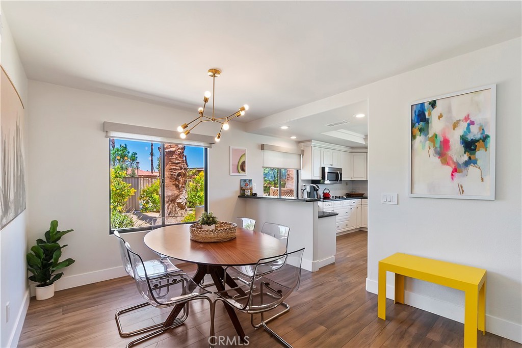 8 Valencia Drive Rancho Mirage, CA 92270 - Photo 11 of 20 a view of a dining room with furniture and wooden floor