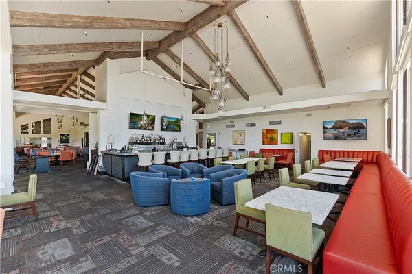 a living room with lots of furniture and clutter