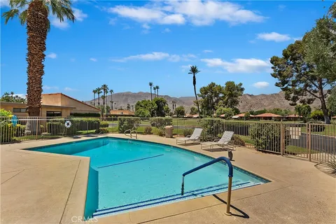 a view of a patio with swimming pool