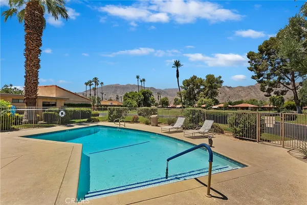 a view of a patio with swimming pool