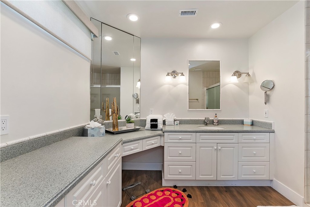 8 Valencia Drive Rancho Mirage, CA 92270 - Photo 6 of 20 a bathroom with a sink and a mirror