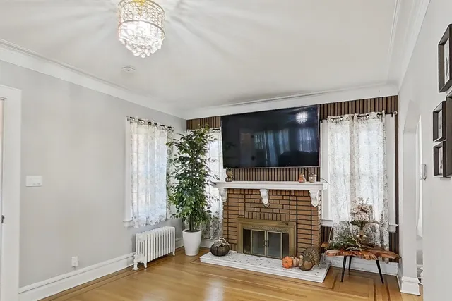a view of a livingroom with furniture and a fireplace