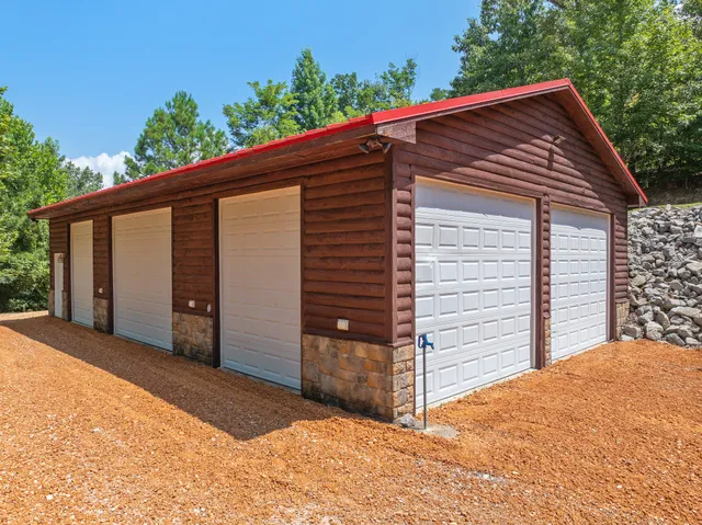 a living room with furniture ceiling fan and a rug