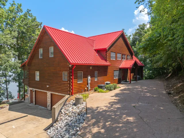 a spacious bedroom with bed and large windows