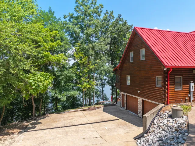 a bathroom with a double vanity sink toilet and shower