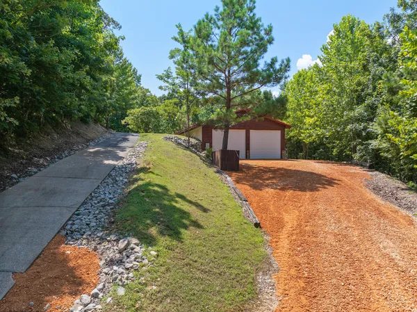a bathroom with a double vanity sink mirror and shower