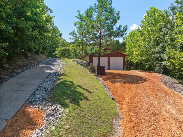 a bathroom with a double vanity sink mirror and shower