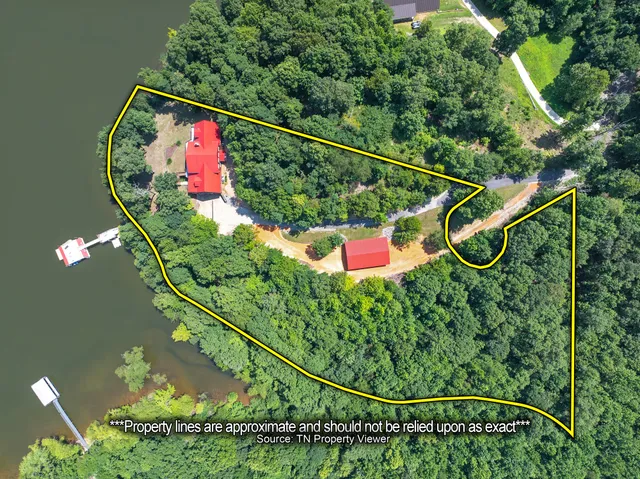 a living room with furniture and large windows