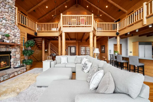 a living room with furniture and a chandelier