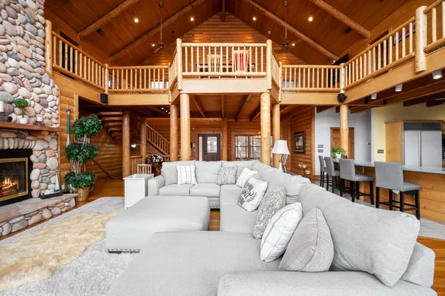 a living room with furniture and a chandelier