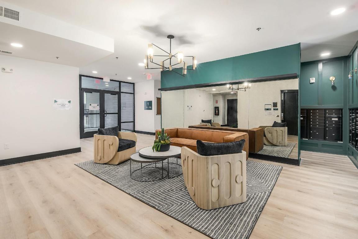 2500 Longview Street, Unit 501 Austin, TX 78705 - Photo 11 of 23 a living room with furniture a ceiling fan and a rug