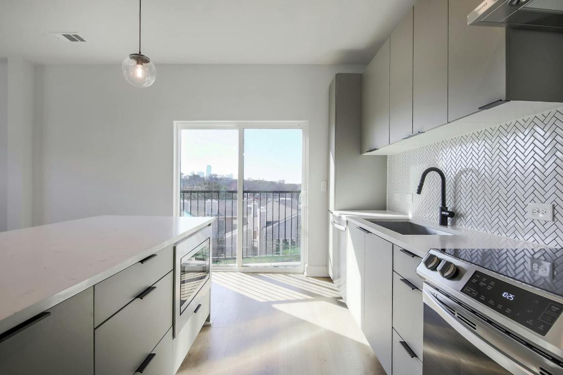 2500 Longview Street, Unit 501 Austin, TX 78705 - Photo 3 of 23 a kitchen that has a sink and a stove