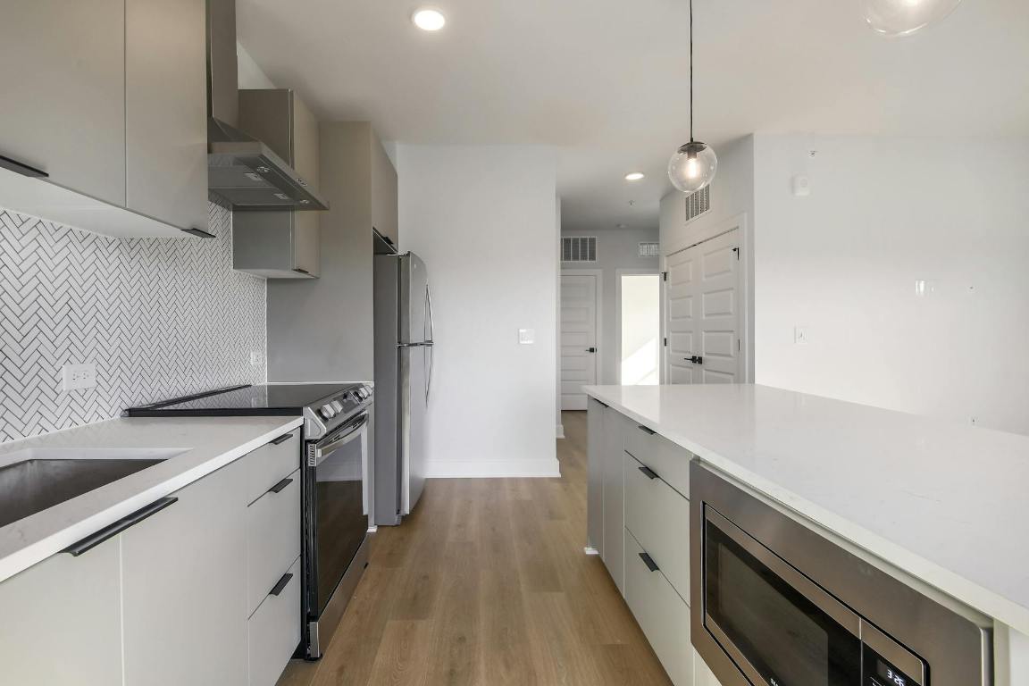 2500 Longview Street, Unit 501 Austin, TX 78705 - Photo 4 of 23 a kitchen with a stove and a sink