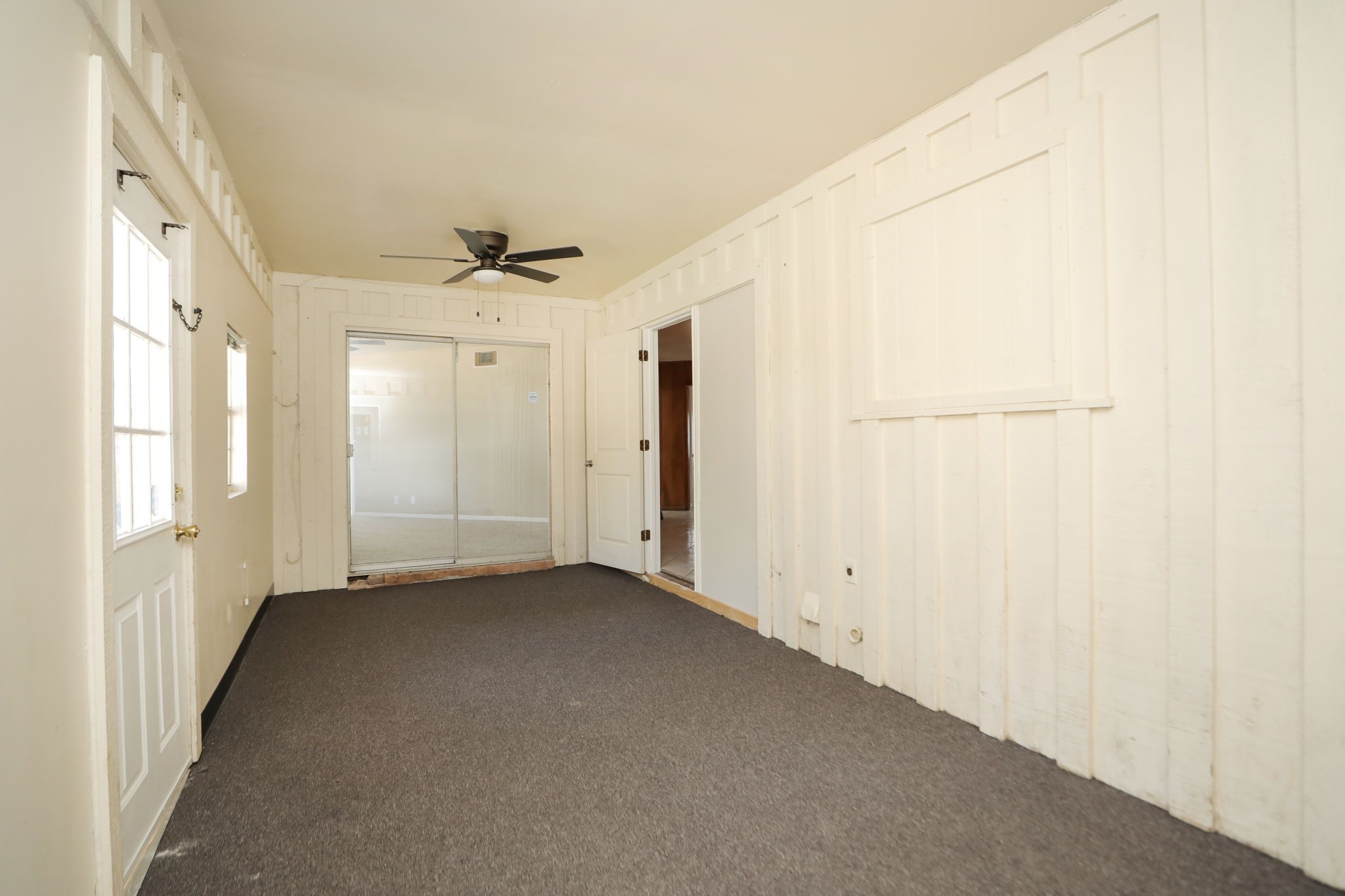 8235 Dover Street Houston, TX 77061 - Photo 19 of 36 a view of a livingroom with a ceiling fan and window