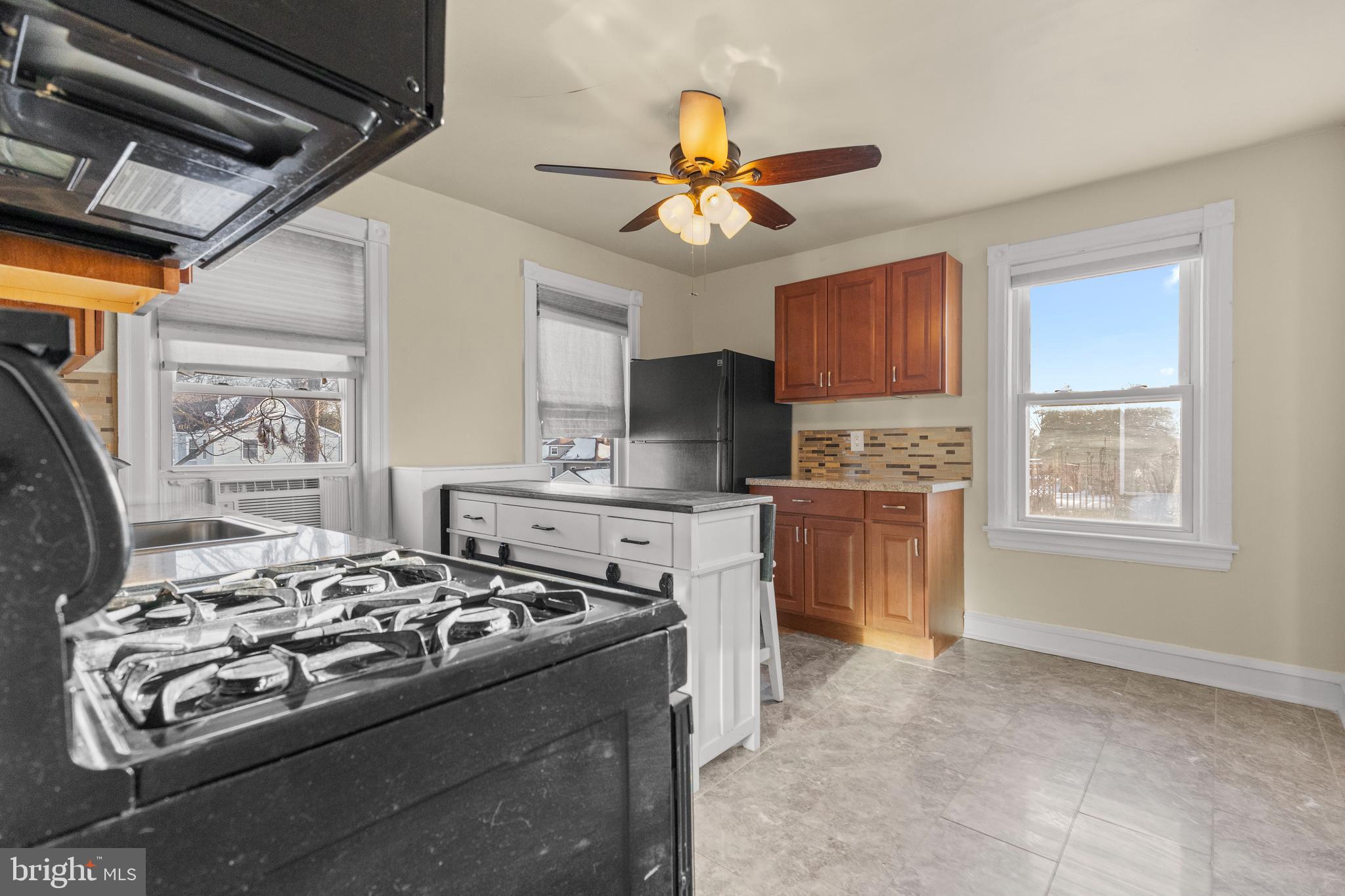 116 Chestnut Street, Unit 2 Audubon, NJ 08106 - Photo 4 of 12 a kitchen with a stove and a refrigerator
