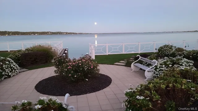 a view of a room with table and chairs