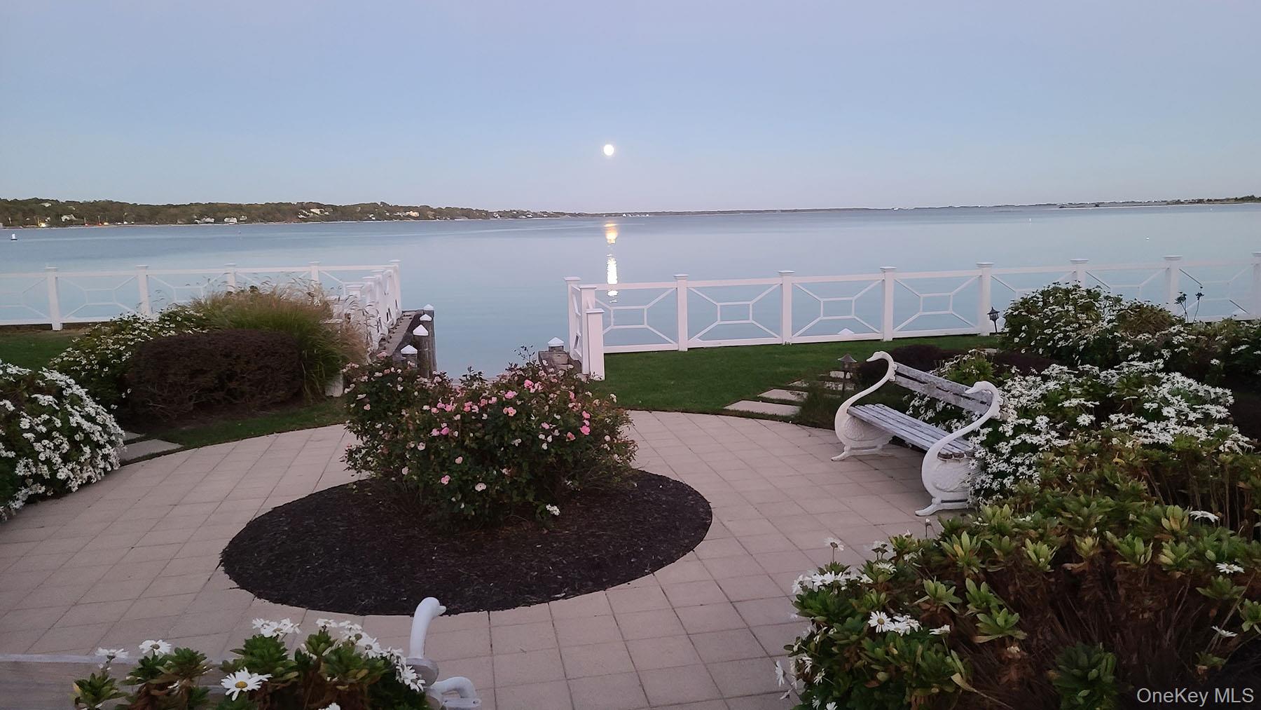 62 Canoe Place Road, Unit 627 Hampton Bays, NY 11946 - Photo 26 of 27 a view of a outdoor space and a lake view