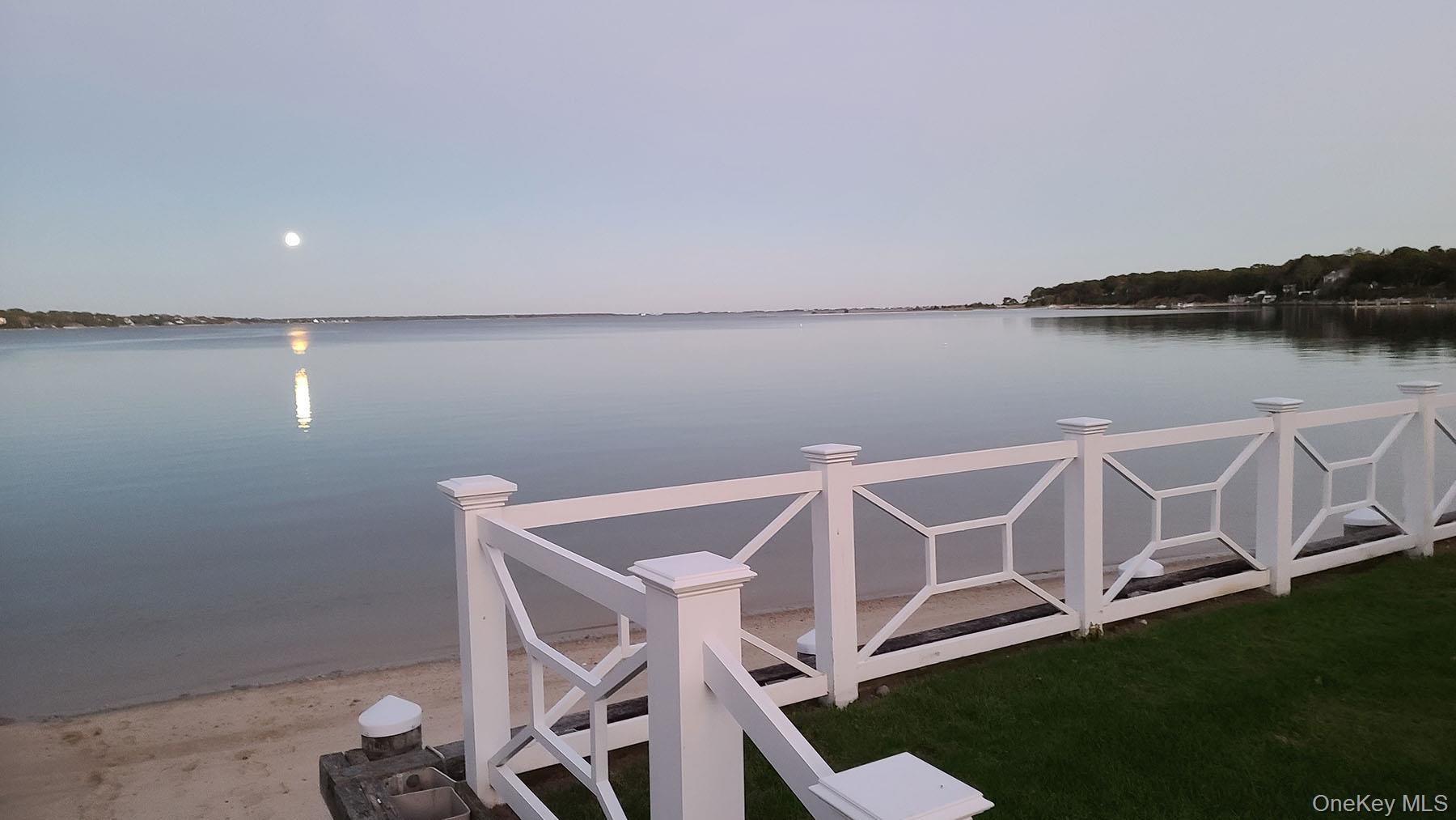 62 Canoe Place Road, Unit 627 Hampton Bays, NY 11946 - Photo 27 of 27 a view of a room with table and chairs
