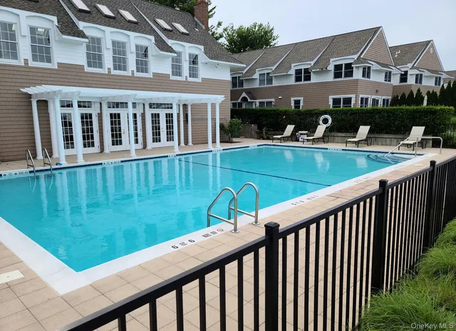 a view of a house with a yard from a balcony