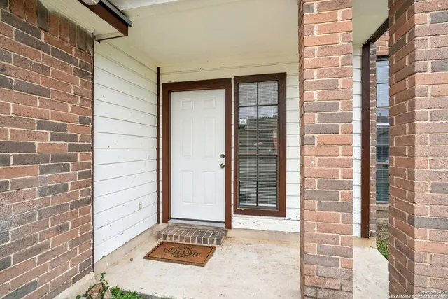 a view of a door and a window