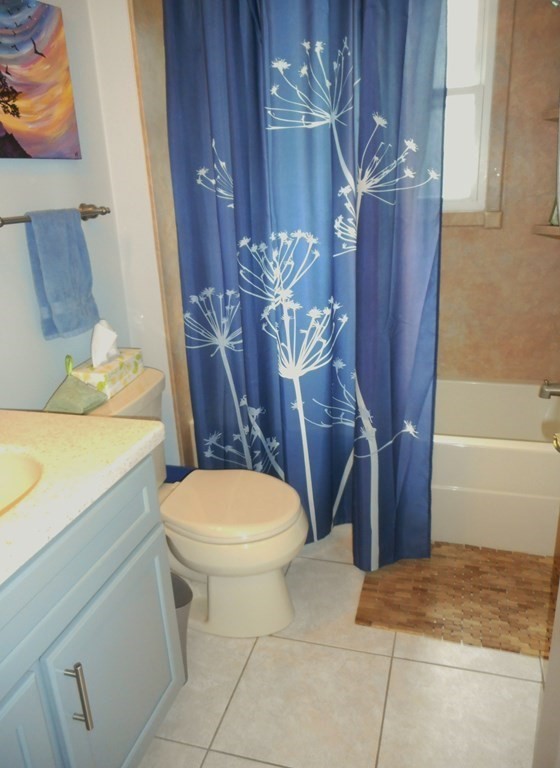 2 Poe Road Billerica, MA 01821 - Photo 12 of 34 a bathroom with a sink a toilet and shower