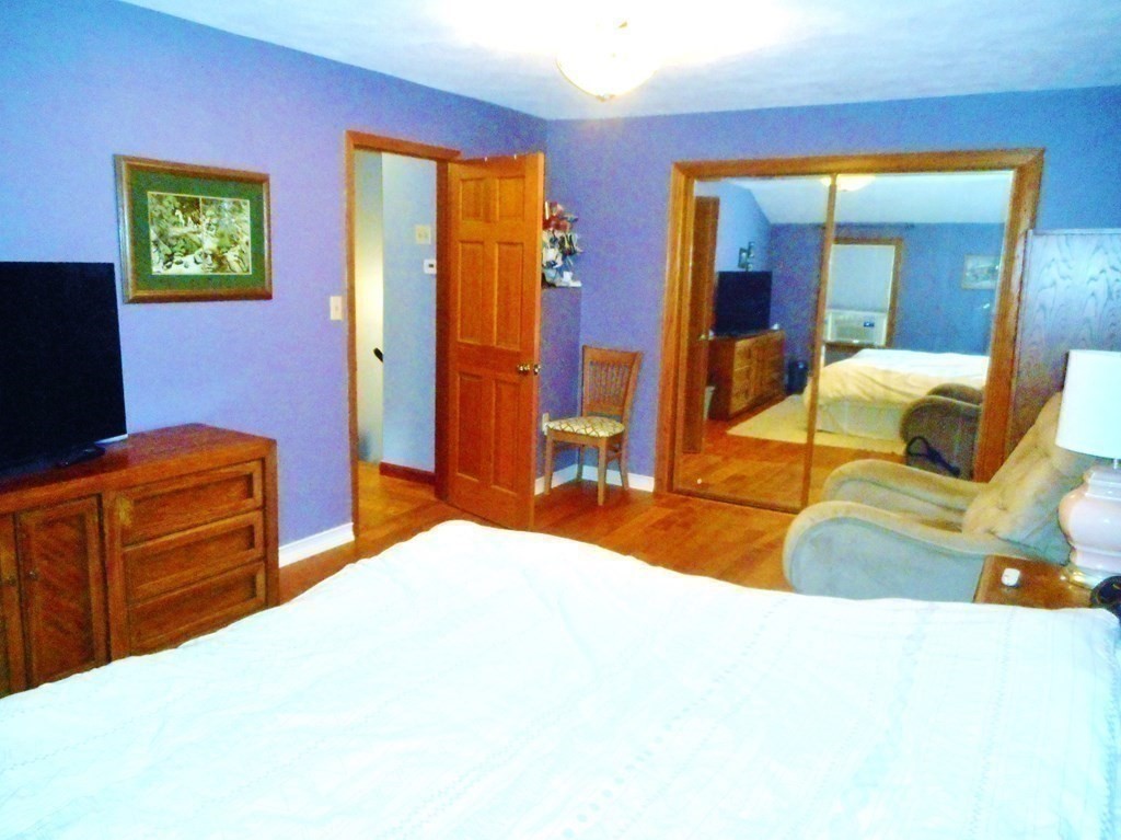 2 Poe Road Billerica, MA 01821 - Photo 15 of 34 a bedroom with a bed and dresser