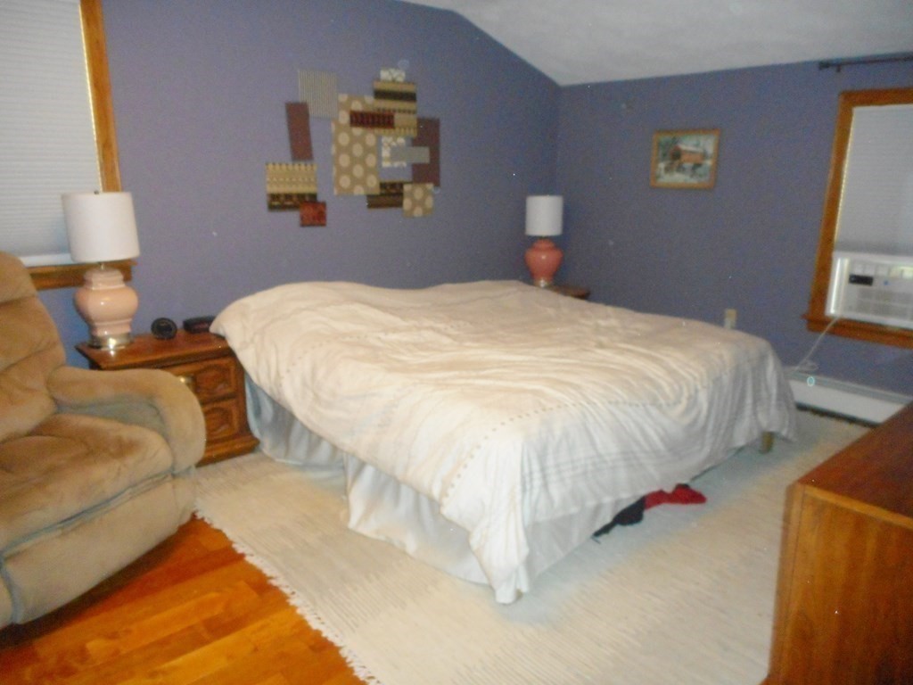 2 Poe Road Billerica, MA 01821 - Photo 16 of 34 a bedroom with a bed and a lamp on dresser