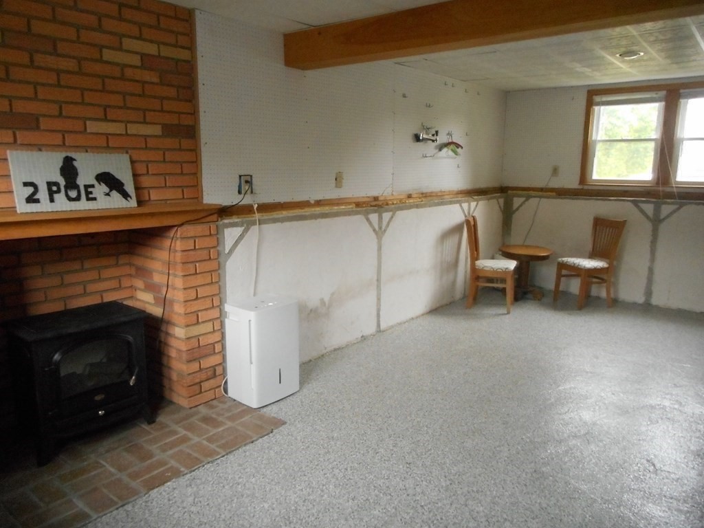2 Poe Road Billerica, MA 01821 - Photo 23 of 34 a living room with furniture and a fireplace
