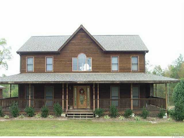 1508 Northside Road Creedmoor, NC 27522 - Photo 1 of 1 a front view of a house with garden