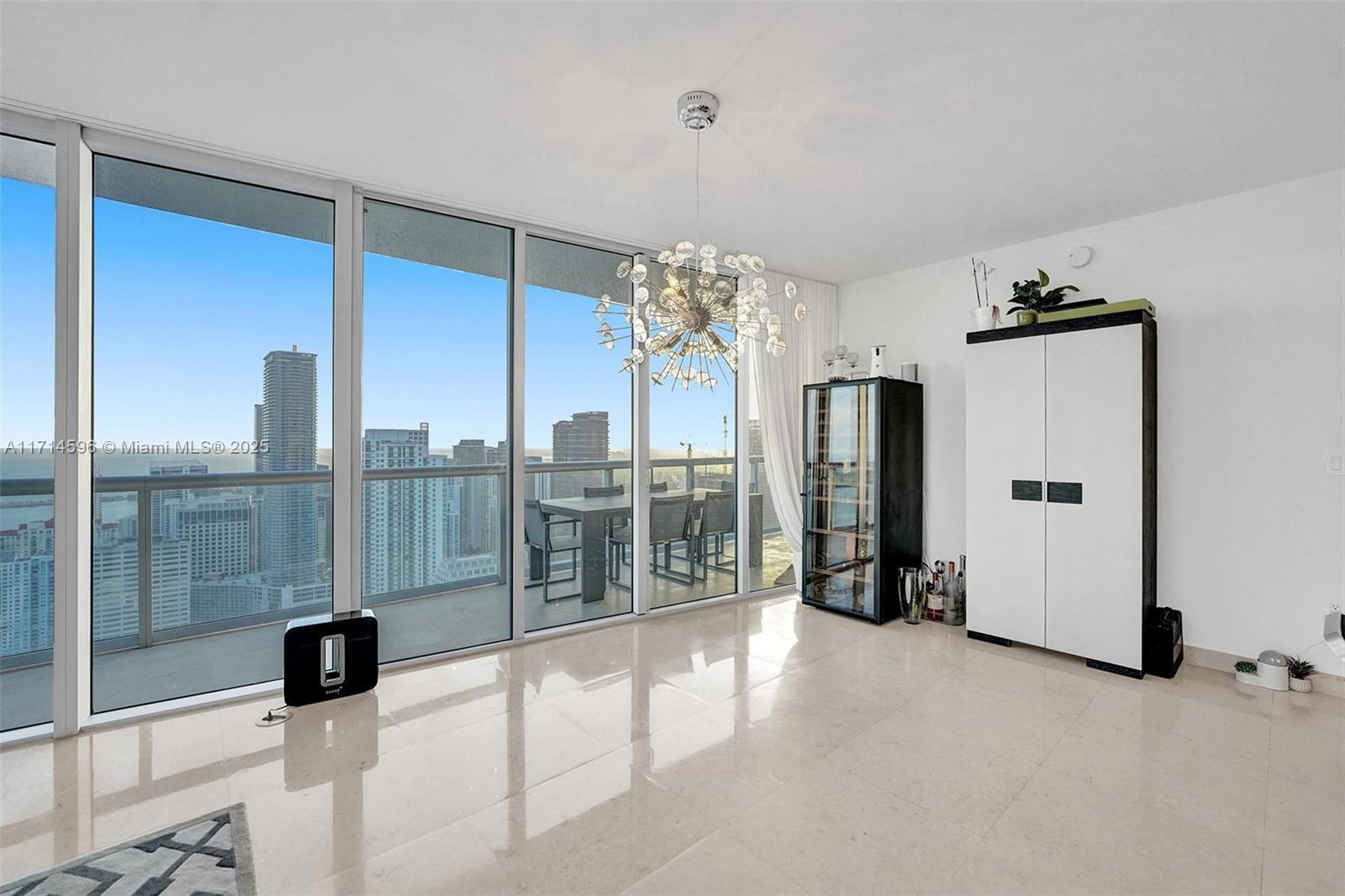 495 Brickell Avenue, Unit PH5701 Miami, FL 33131 - Photo 12 of 31 a view of a living room with a large window