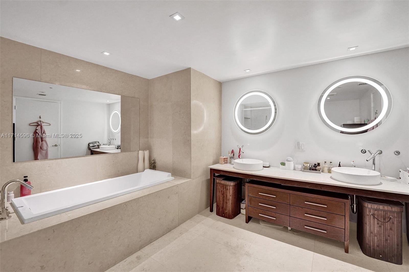 495 Brickell Avenue, Unit PH5701 Miami, FL 33131 - Photo 13 of 31 a bathroom with a double vanity sink and a mirror