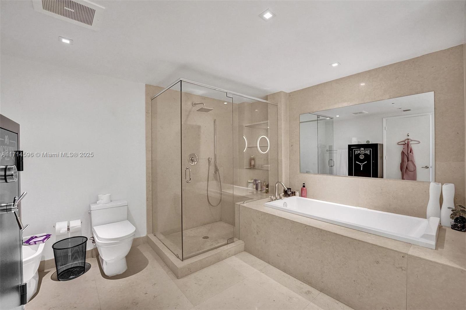 495 Brickell Avenue, Unit PH5701 Miami, FL 33131 - Photo 15 of 31 a spacious bathroom with a double vanity sink toilet and shower