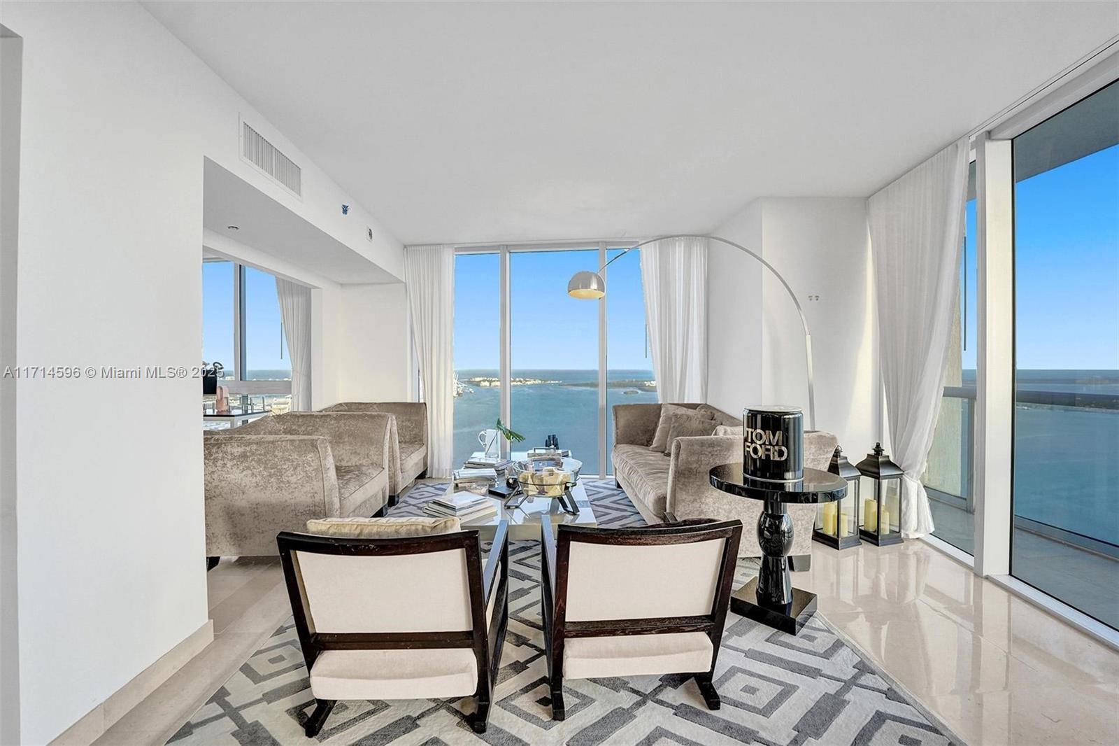 495 Brickell Avenue, Unit PH5701 Miami, FL 33131 - Photo 7 of 31 a dining room with furniture and a window