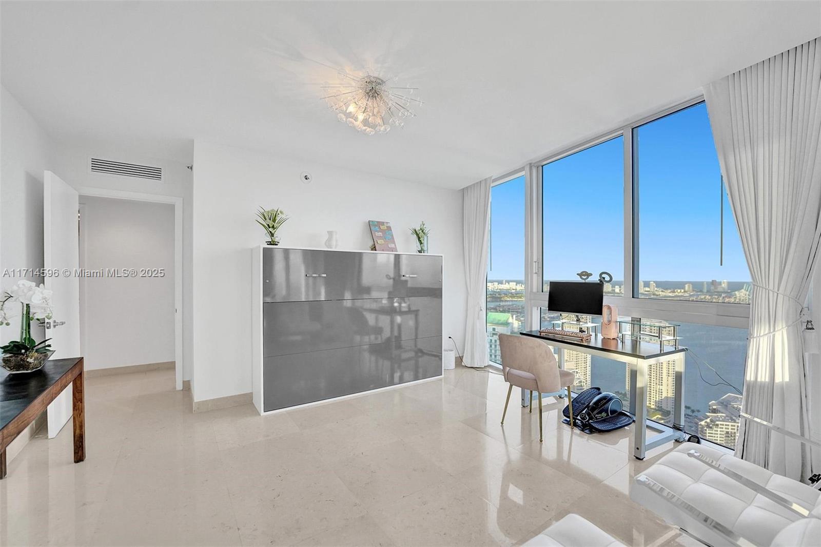 495 Brickell Avenue, Unit PH5701 Miami, FL 33131 - Photo 9 of 31 a view of kitchen with furniture and refrigerator in kitchen