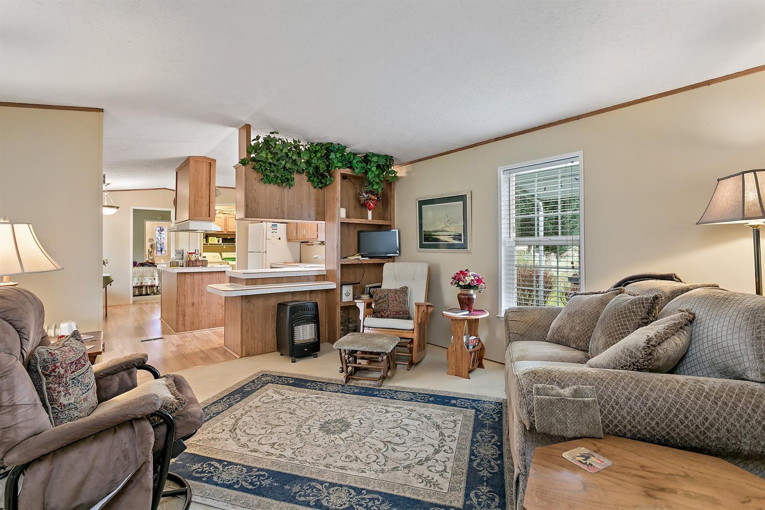 4930 Leonard Road Grants Pass, OR 97527 - Photo 6 of 33 a living room with furniture and a fireplace