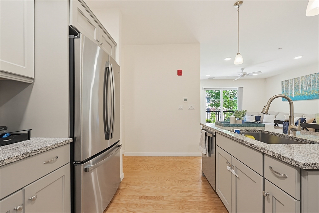 200 Revere Street, Unit 4209 Canton, MA 02021 - Photo 12 of 35 a kitchen with appliances a sink and cabinets