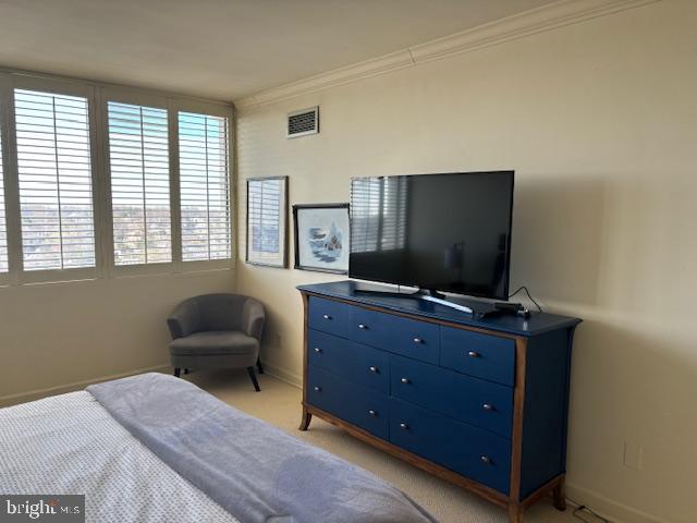 5101 River Road, Unit 1911 Bethesda, MD 20816 - Photo 14 of 32 a bedroom with a bed and flat screen tv