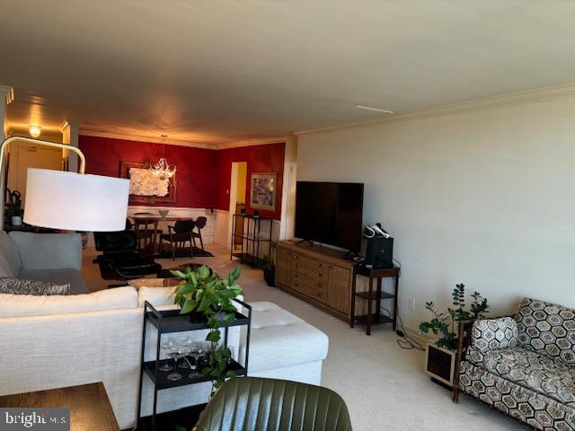 5101 River Road, Unit 1911 Bethesda, MD 20816 - Photo 6 of 32 a living room with furniture and a flat screen tv