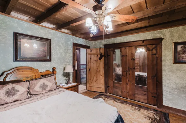 a bed room with a bed and a walk in closet