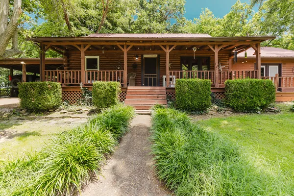 front view of a house with a yard