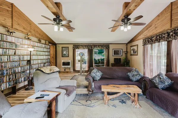 a kitchen with stainless steel appliances granite countertop a sink a stove and cabinets