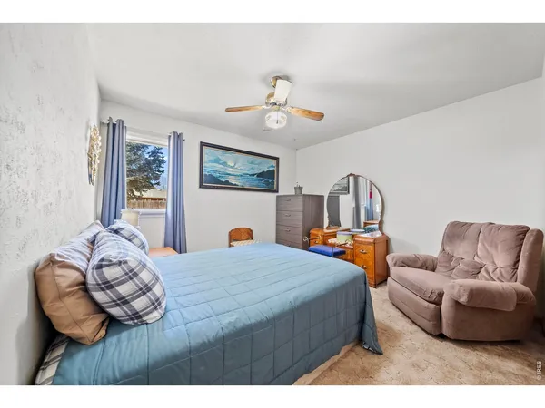 a bedroom with furniture and window