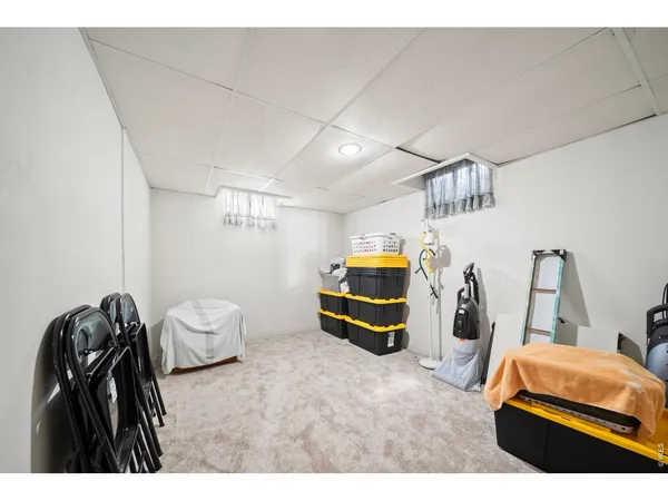 a bedroom with a bed and a wooden floor