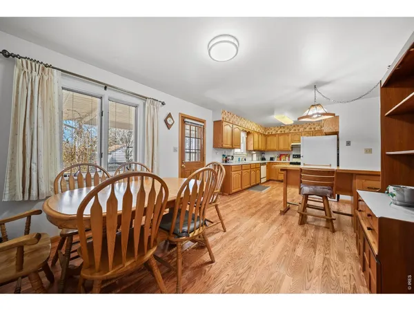 a view of a livingroom with furniture window and wooden floor