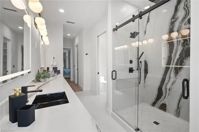 a bathroom with a bathtub and a shower